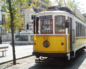 Naklejka na ściany i meble Old yellow tram in Lisbon, Portugal
