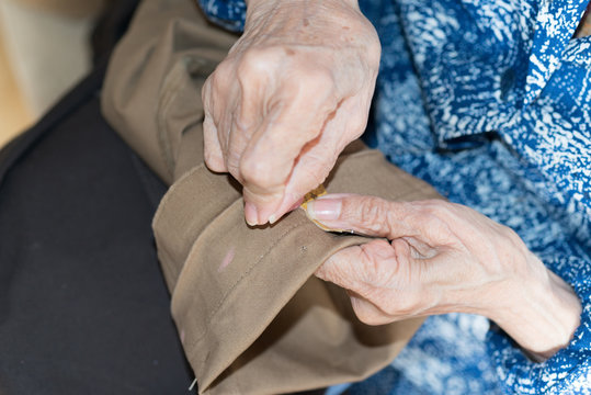 sewing elderly person