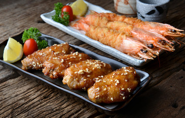 Fried chicken wing and shrimps with spicy sauce in Japanese style.