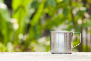 Stainless cup on table.