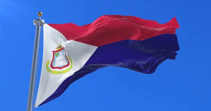 Flag of Sint Maarten waving at wind in slow with blue sky, loop