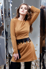 Beautiful woman sexy lady spring autumn collection glamor model fashion clothes wear style for date brown short dress accessory handbag pretty face dark natural hair makeup party fun celebrate holiday