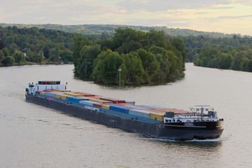 Efficient and eco-responsible supply using barges and river - obrazy, fototapety, plakaty