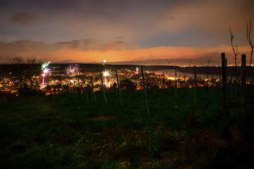 Fireworks on New Year's Eve over the roofs of the city of Nierstein at the Rhine