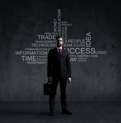 Businessman with briefcase standing over wall with text. Business, success, improvement, concept.  