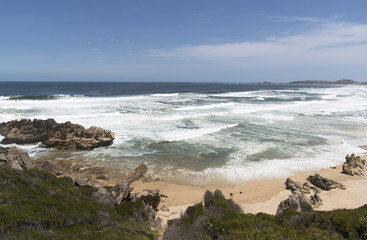 Fototapeta na wymiar Brenton on Sea Western Cape South Africa. December 2017.The quiet beach and Indian Ocean at this resort which is close to Knysna.