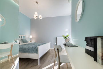 Stylish bedroom with mirror wal