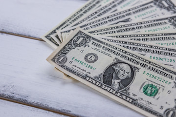 One dollars on wood background, money