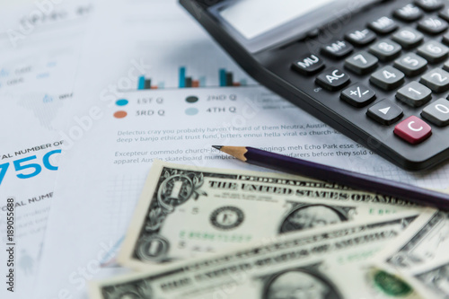 Calculator With American Dollars On The Wooden Table Background Calculator With American Dollars On The Wooden Table Background Finance Concept