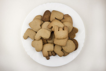 Biscuits love on a white plate and against a white background