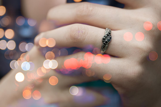 Black diamond ring on lady's funger