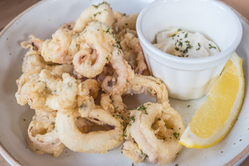 Squid fried dough with sweet sauce and lime