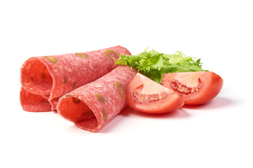 Traditional slices salami smoked sausage, combined with green olive, isolated on white background.