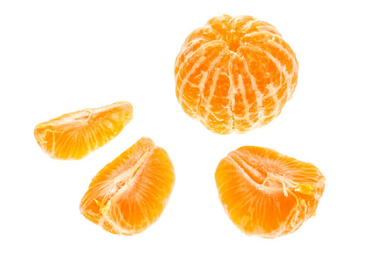 Orange tangerines mandarin pieces isolated on white background.