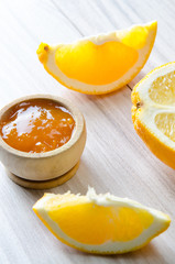 Orange jam served in spoon on the table