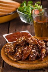 Grilled chicken wings with hot sauce