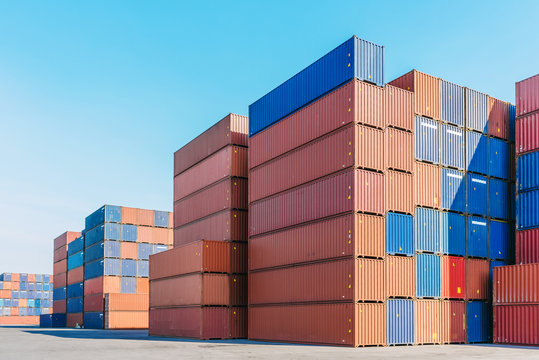 Industrial port with containers box for logistic export import business with clear blue sky in background