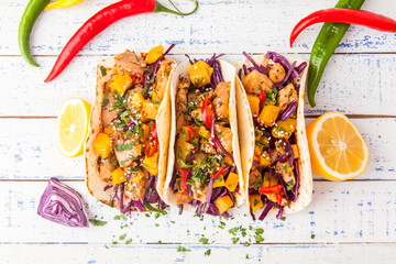 Mexican pork tacos with vegetables and pumpkin. Tacos on wooden white rustic background. Top view. - 189064027
