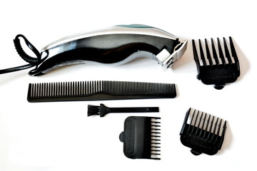 Set of barber tools for haircut with electric clipper and brush. Isolated. White background