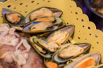 Fresh mussels in basket