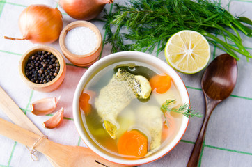 Fish soup served on the table in plate