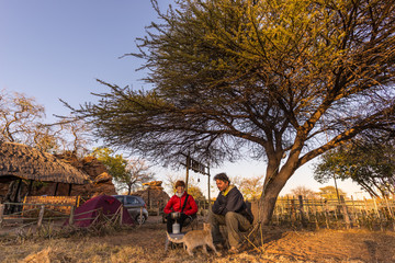 Couple selfie having breakfast, camping outdoors, morning cold. Travel adventure in Kruger National...