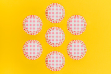 Cardboard cupcakes boxes on retro colour background
