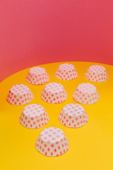 Cardboard cupcakes boxes on retro colour background