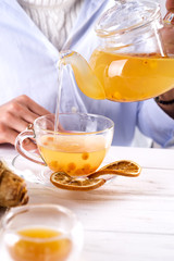 Hot herbal tea with sea buckthorn.