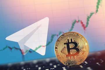 Gold Bitcoin on background of shares coins telegram.