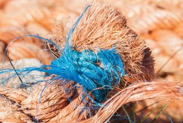 Lashings of Blue / A close up image of blue nylon cord used as whipping on the end of orange colour nylon rope