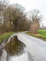 track with mirror in water puddle