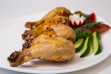 chicken legs on the grill