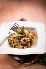 tagliatelle with butter sage and parmesan cheese, selective focus