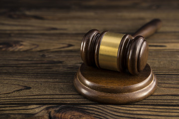 hammer of judge on a wooden table. close-up. law, crime and punishment, the court.