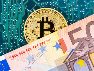 Fototapeta na wymiar Digital cryptocurrency gold bitcoin, electronic computer component and euro banknotes. Business concept of new digital money