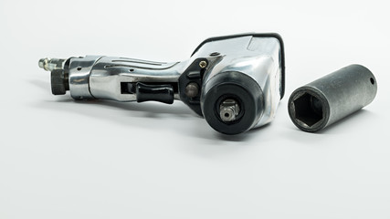 Mechanics air wrench and socked used for removing wheels form a car