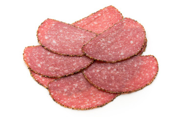 Salami slices isolated on the white background.