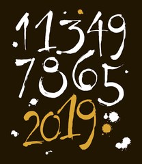 set of calligraphic acrylic or ink numbers. ABC for your design, brush lettering on a black background with blots