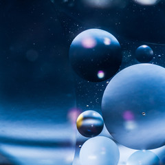 water and oil, beautiful color abstract background based on blue circles and ovals, macro abstraction © Aliaksei
