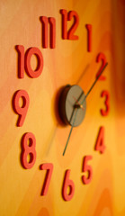 large wall clock with colorful numbers