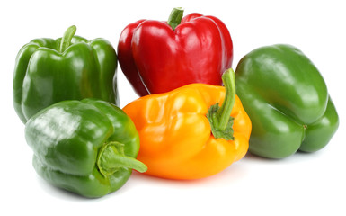 green, red, yellow sweet bell peppers isolated on white background