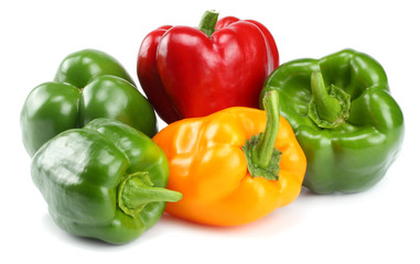 green, red, yellow sweet bell peppers isolated on white background