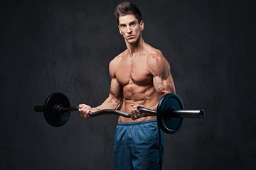 Athletic shirtless male biceps barbell workout. 