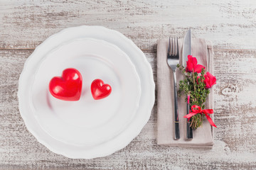 Rustic table setting with thyme and cyclamen flowers