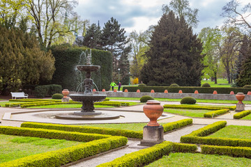 Fototapeta premium PRAGUE, CZECH REPUBLIC - APRIL, 25, 2017: The Singing Fountain in Kralovska Zahrada the Royal Gardens park in Hradcany. Luxury park style.