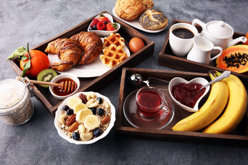 Breakfast served with coffee, orange juice, croissants and fruits. Balanced diet.
