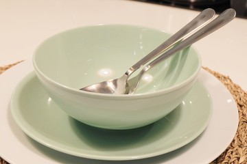 Set of Porcelain Plates, Bowls and Silverware