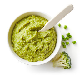 Green peas and broccoli baby puree isolated on white