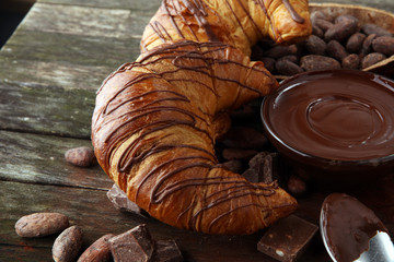 Fresh homemade croissants with chocolate. Sweet bakery concept.